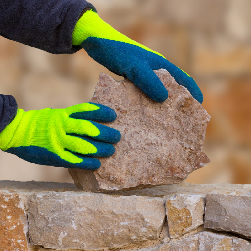 man holding a stone